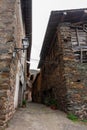 A typical narrow street between old slate stone buildings Royalty Free Stock Photo