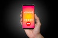 Robocall and warning alert on smartphone screen. Smartphone cybersecurity concept