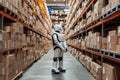 A robot aiding a warehouse worker in efficient inventory management, streamlining logistics