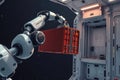 Robot arm detaching cargo container during orbital transfer Royalty Free Stock Photo
