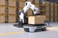 The Robot arm picks up the box to Autonomous Robot transportation in warehouses, Warehouse automation concept