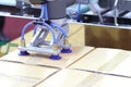 The robot arm transfers carton box to conveyor line