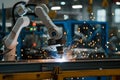 robot arm welding automotive parts on a factory line Royalty Free Stock Photo