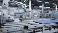 Robot arms placing solar panels on large production line, 3D illustration