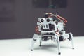 Robot close up. A small gray robot is on the table Royalty Free Stock Photo