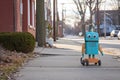 robot courier avoiding obstacles on sidewalk