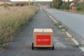 Robot courier, rides along the street of a small town. Delivery of online order