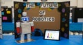 Student science fair project showcasing a robot and tablet with robotics data display Royalty Free Stock Photo