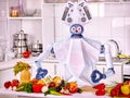 Robot domestic assistance cook vegetarian food at kitchen.