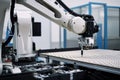 robot on factory floor, performing final inspection of printed product