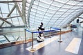 robot in full growth in museum energy of future. glass dome with solar panels. autonomous personal assistant robot for navigation