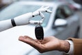 Robot Giving Car Key To Man Royalty Free Stock Photo