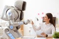 Robot giving cup of coffee to the girl Royalty Free Stock Photo