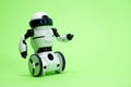Robot on a green background with a place for text for a toy store and children's technology centers. Royalty Free Stock Photo