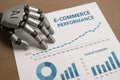 Robot Hand Analyzing E?Commerce Sales Performance Report Royalty Free Stock Photo