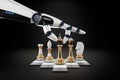 Robot hand, artificial intelligence plays chess. Concept: Solving human problems, developing a neural network, advanced technology