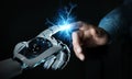 Robot hand creating electricity with human hand 3D rendering Royalty Free Stock Photo