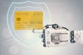 Robot hand holding credit card Royalty Free Stock Photo