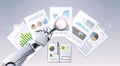 Robot hand holding magnifying glass financial graphs report data analysis top angle view artificial intelligence digital Royalty Free Stock Photo