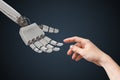 Robot hand and human hand are touching. Artificial intelligence and cooperation concept