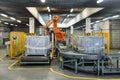 Robot Hand manipulator packaging factory products from conveyor into container