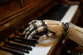 A robotic hand gracefully interacts with a piano keyboard in a cozy, vintage room Royalty Free Stock Photo