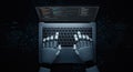 Robot hands typing on a laptop keyboard in a dark room Royalty Free Stock Photo