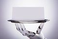 Robot Holding Blank Card In Plate Royalty Free Stock Photo