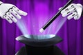 Robot Holding Magic Wand Over Illuminated Hat Royalty Free Stock Photo