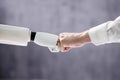 Robot And Human Hand Making Fist Bump Royalty Free Stock Photo