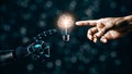Robot and Human Hand Touching Light Bulb Symbolizing Innovation and Artificial Intelligence Royalty Free Stock Photo