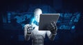 Robot humanoid using tablet computer for global network connection Royalty Free Stock Photo