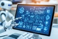 Robot interacting with futuristic data display on computer screen