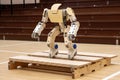 robot, jumping over obstacle course, showing off its agility and balance
