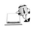 Robot leaning on a notebook Royalty Free Stock Photo