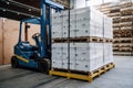 robot, loading heavy boxes into shipping container, using built-in forklift