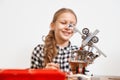 Robot made with building kit by girl. Royalty Free Stock Photo