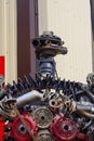 A robot made of car parts on the street in front of an auto parts store Royalty Free Stock Photo