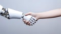 Robot and man hands in handshake. AI technology development and human robot relationships