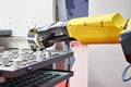 Robot manipulator and metal workpieces Royalty Free Stock Photo