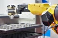 Robot manipulator and metal workpieces Royalty Free Stock Photo