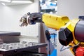 Robot manipulator and metal workpieces Royalty Free Stock Photo