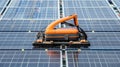 A robot is scrubbing a solar panel with a brush to improve light absorption