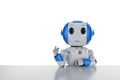 Robot sit on desk Royalty Free Stock Photo