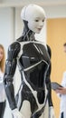 A humanoid robot stands in a modern lab, showcasing advanced robotics technology, AI Royalty Free Stock Photo