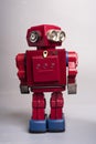 Old toy from the 1950s of a lonely and paradi robot made of red tin