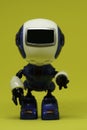 Robot toy on yellow background