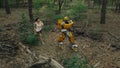 Robot transformer Bumblebee and girl run among forest