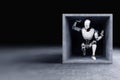 A robot trapped in a concrete box. Artificial intelligence technology, limits to technology, robotics development, singularity. 3D Royalty Free Stock Photo