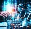 A robot that is typing on a computer keyboard Royalty Free Stock Photo